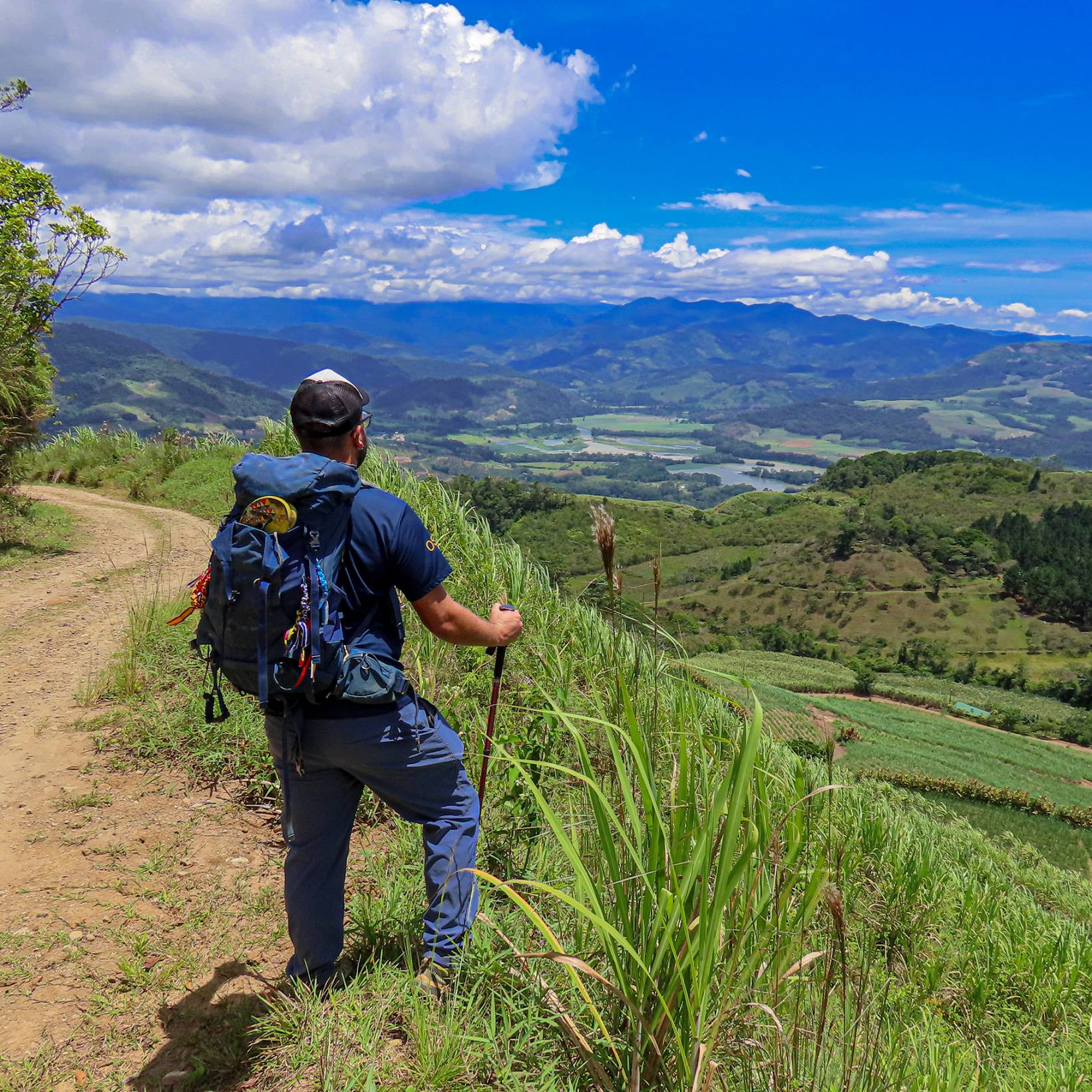 Hiker at Mata viewpoint with a view of Turrialba Valley.