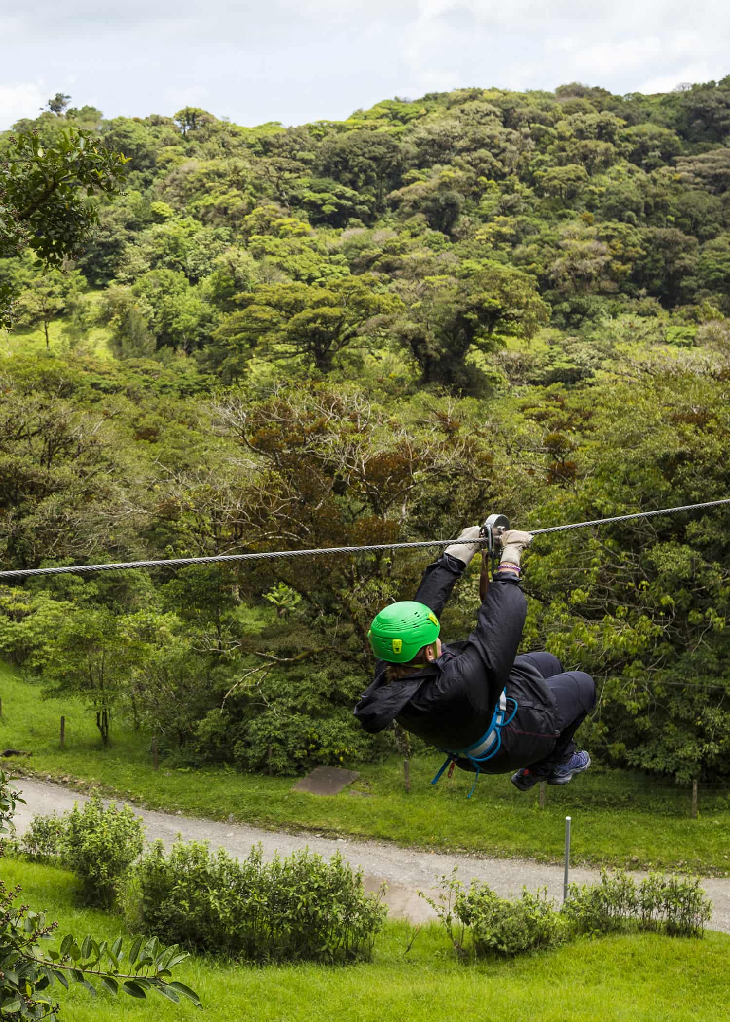 Person doing zipline in Costa Rirca Forest